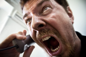 Man shouting at telephone