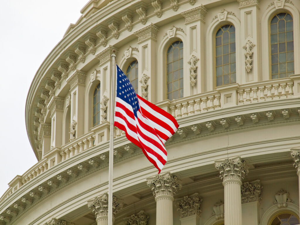 United States Capitol Building in Washington DC with American Flag