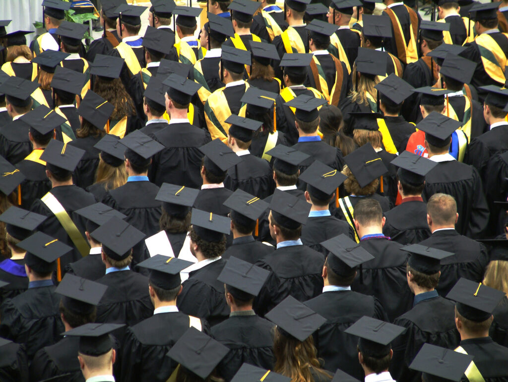 university graduates in full dress at their ceremony.