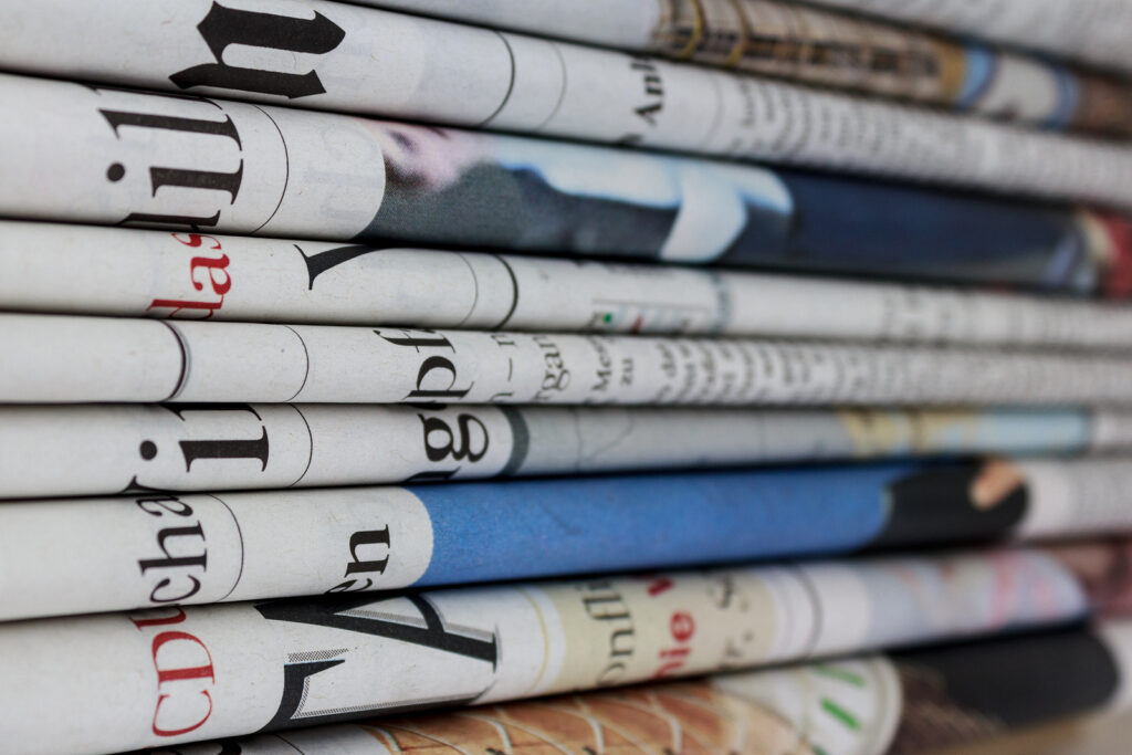 many newspapers stack of newspaper , news