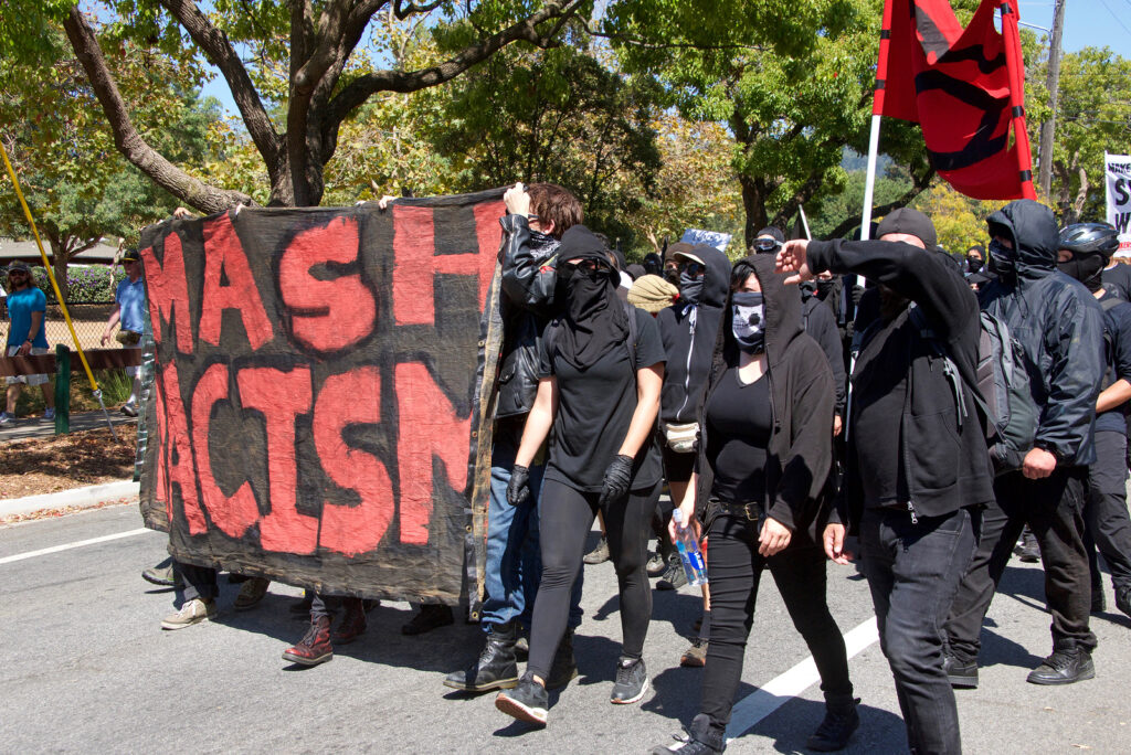 Berkeley CA - August 27 2017: Unidentified participants at the NO TO MARXISM IN AMERICA rally in Martin Luther King Jr. Civic Center Park more counter-protesters than protesters.