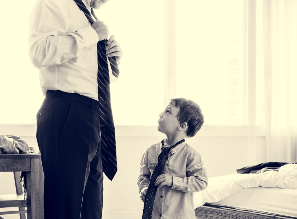 Father teaching the son how to tie like a gentleman