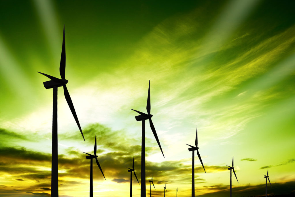 Wind turbines farm at sunset