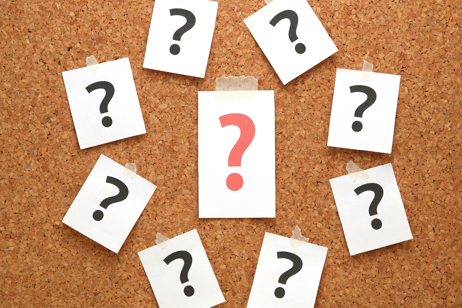 Red Question Mark On A Piece Of Paper And Many Question Marks On Red question mark on a piece of paper and many question marks on cork board.Question concept.